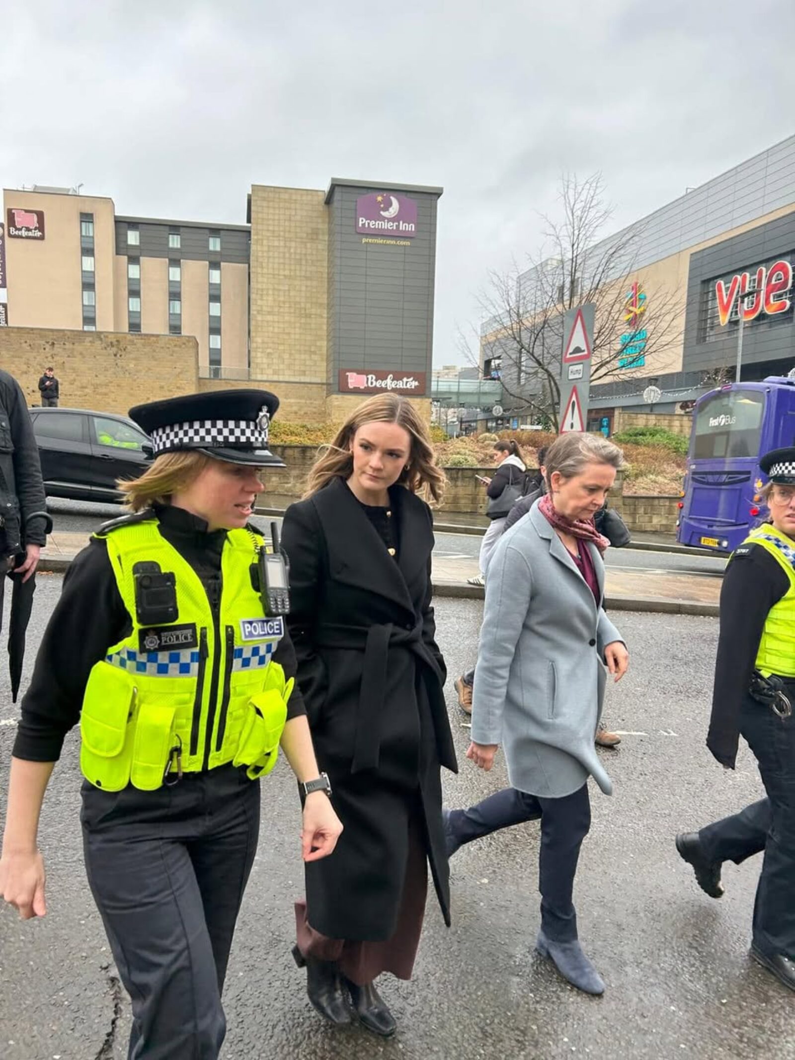Kate with local police and the Home Secretary 