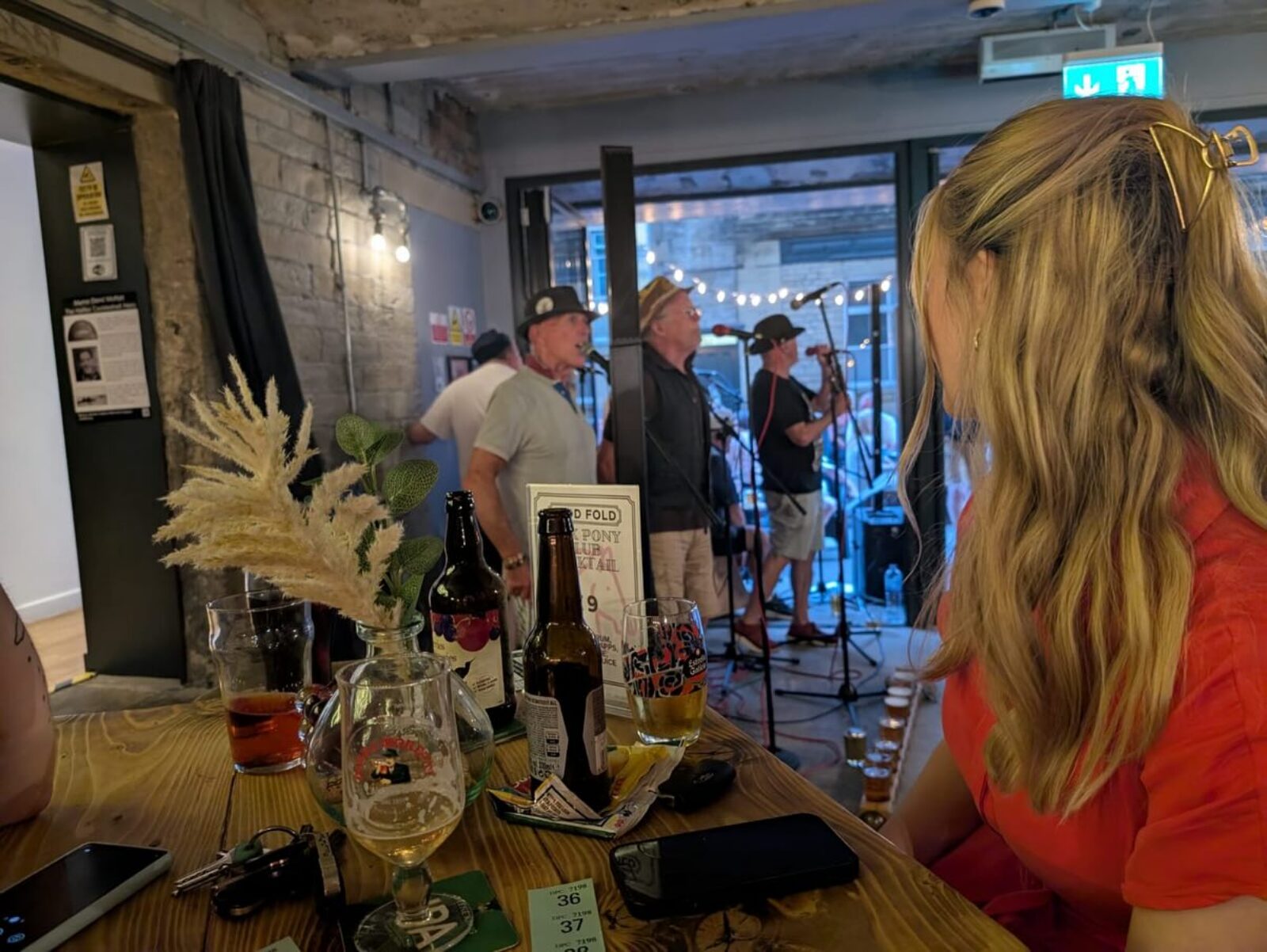Kate Dearden MP listening to the live band